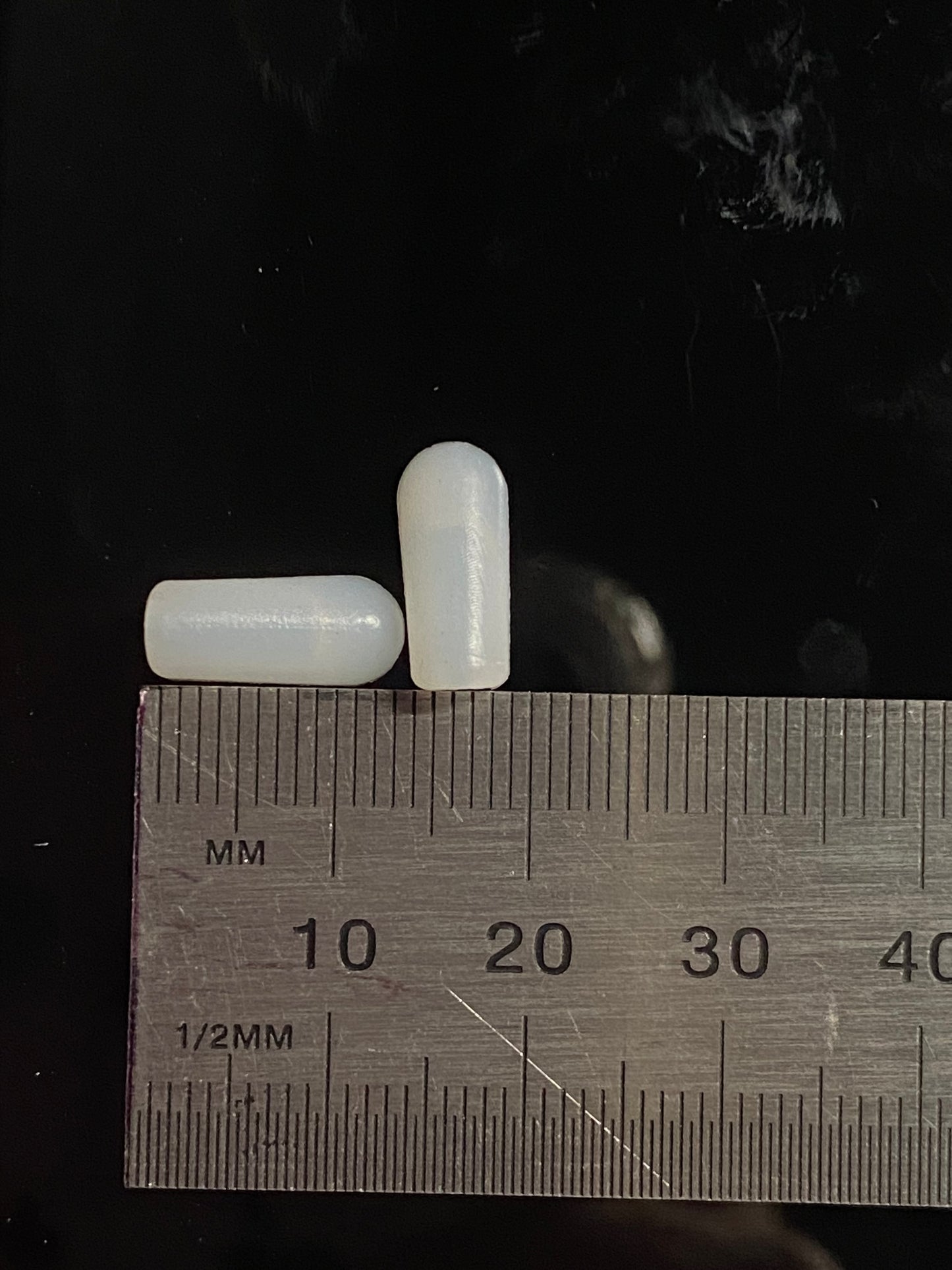 white end cap measuring length and base