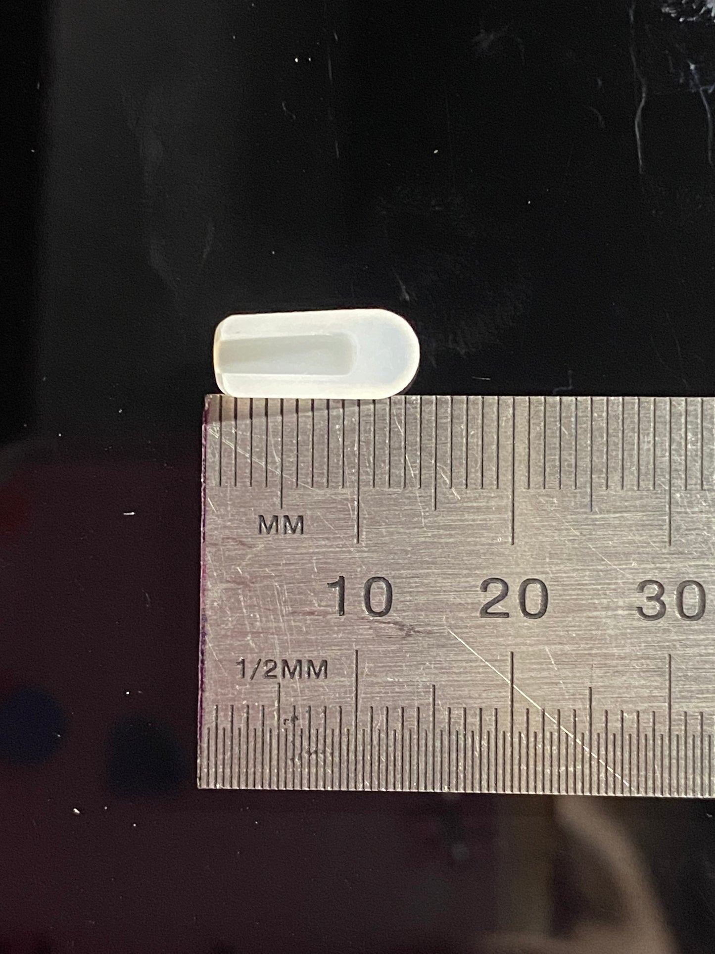 white end cap inverse side with measurement of length