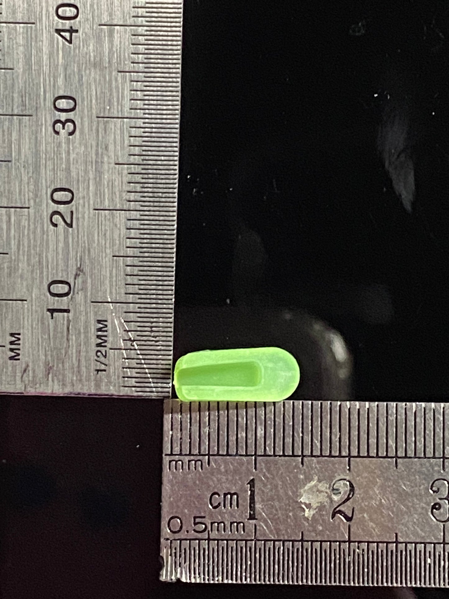 Green end cap with measurements.