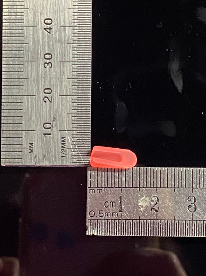 Red end cap inverse view set against rulers measuring both base and length
