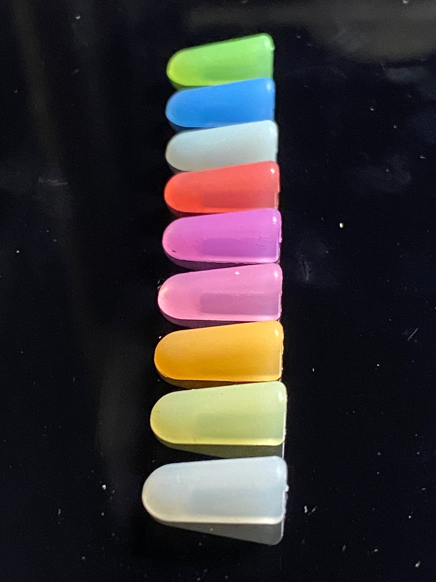 Row of nine colours of end caps