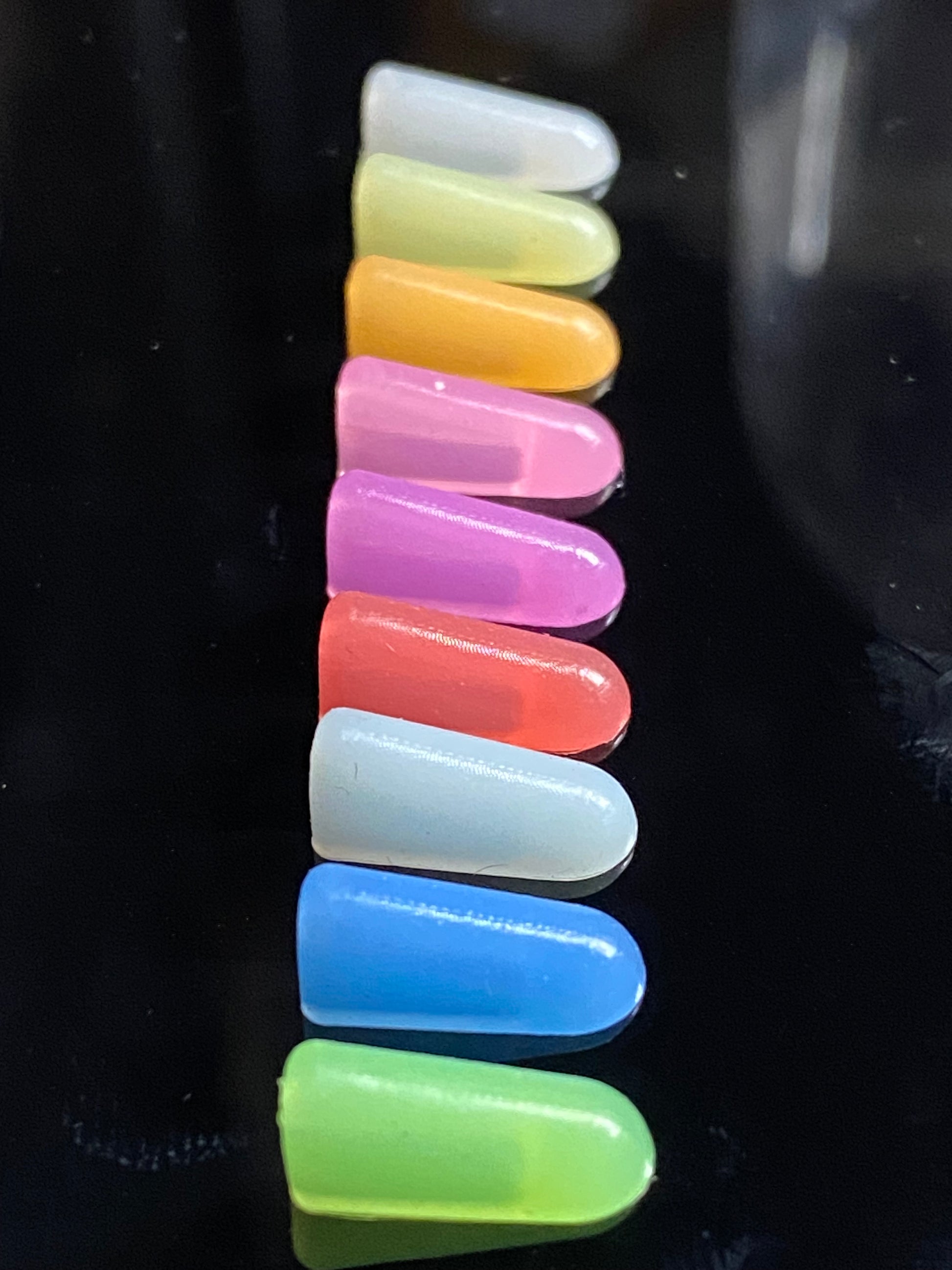 Row of 9 coloured end caps