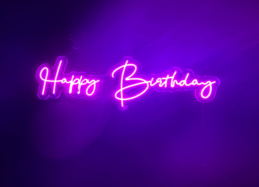 Pink LED Neon "Happy Birthday" cursive on clear acrylic