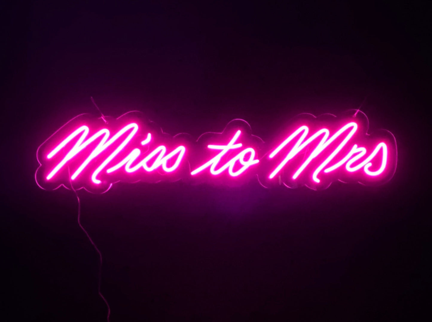 Pink LED Neon sign with 'Miss to Mrs' text on a acrylic