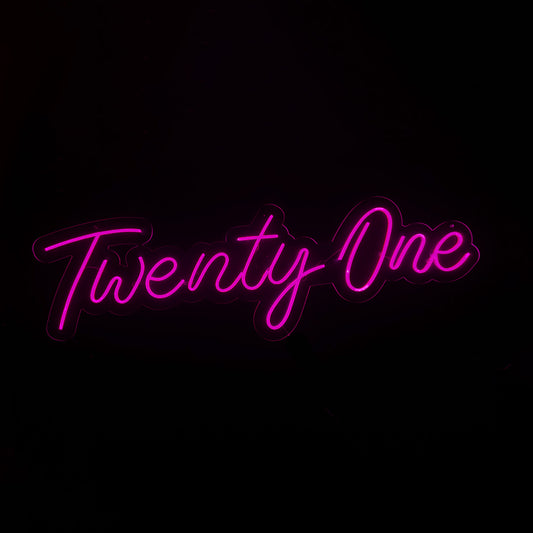 Pink LED Neon "Twenty One" cursive on clear acrylic