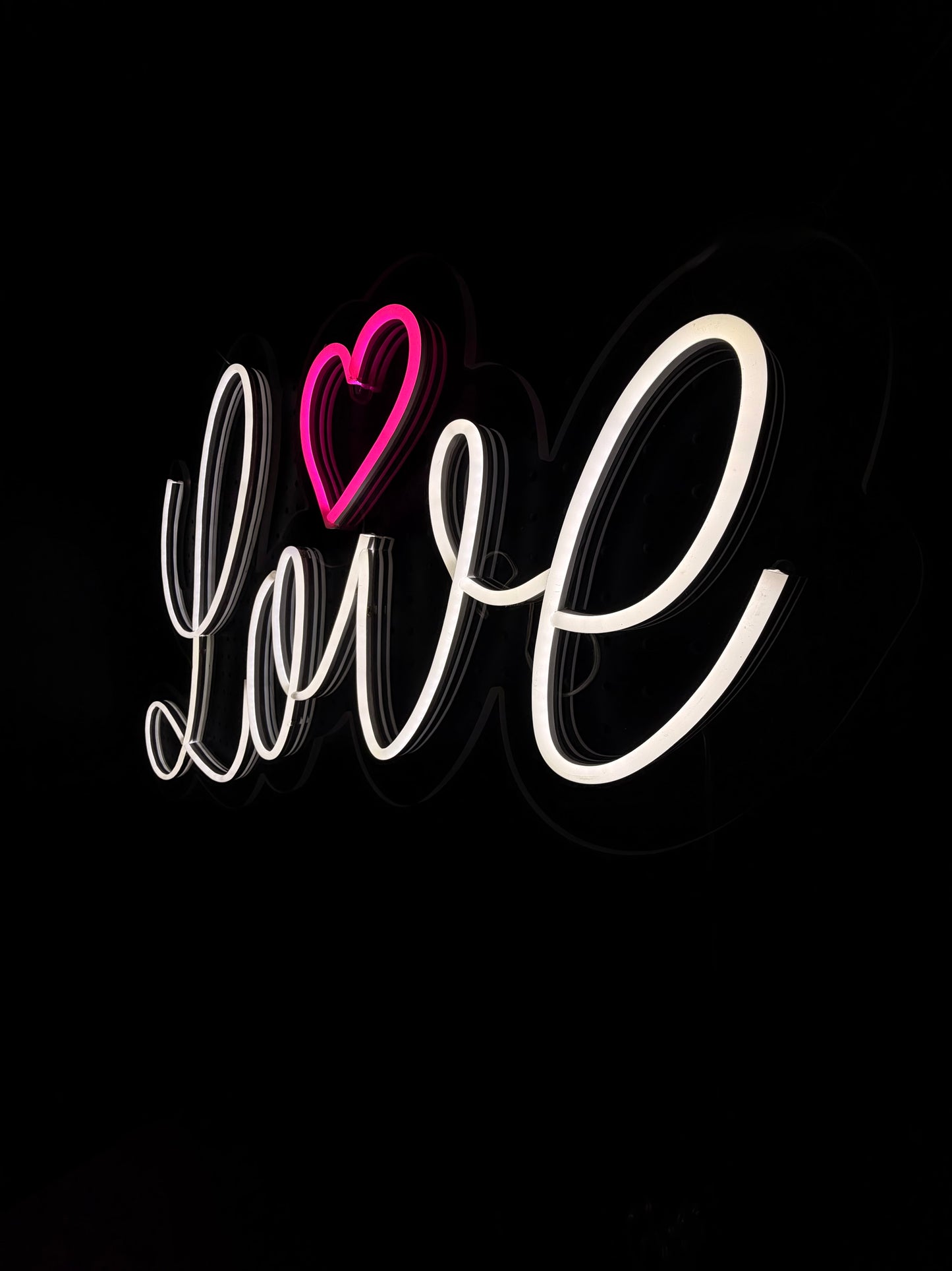 White and Pink LED Neon "Love" cursive and heart shape on clear acrylic