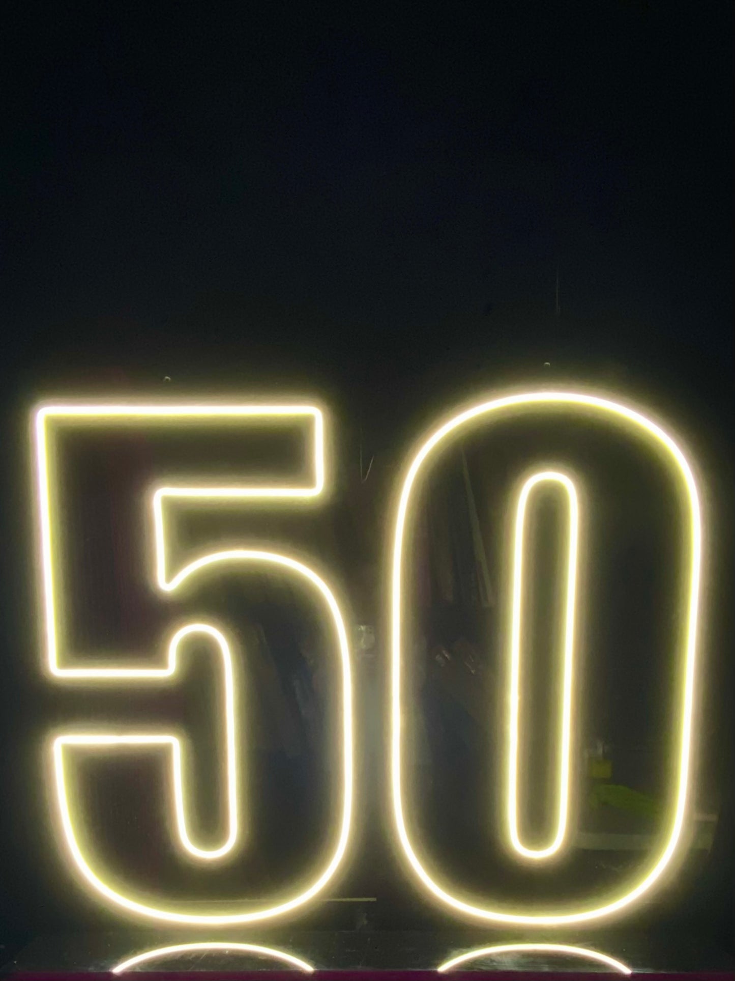 White LED Neon "50" on black acrylic with black acrylic stand