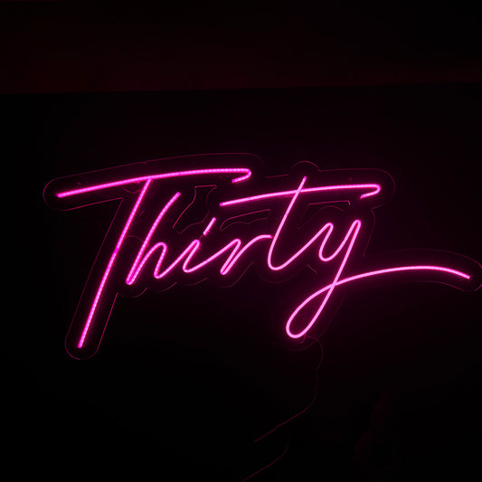 Pink LED  Neon "Thirty" lettering cursive on clear acrylic
